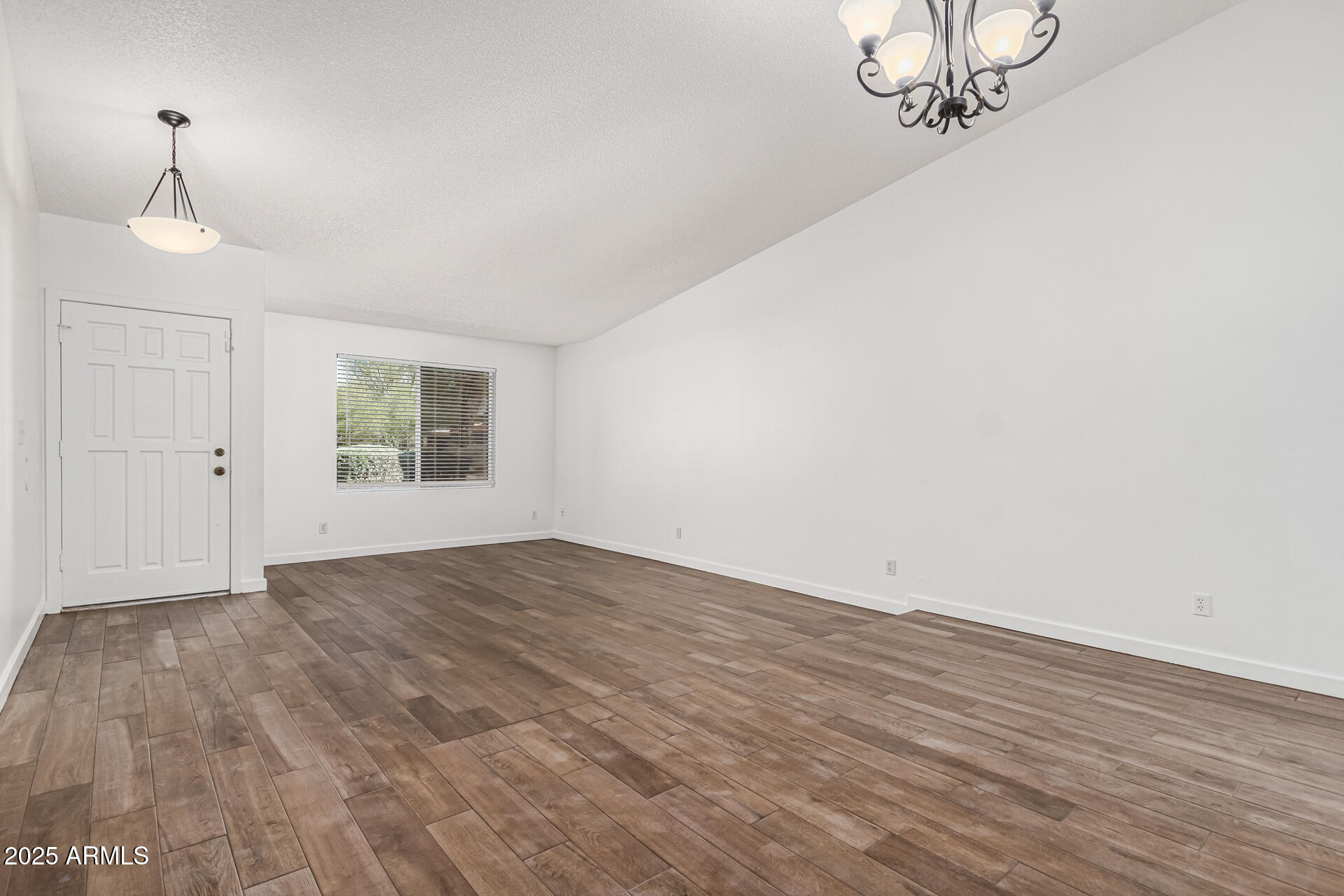 14034 North 60th Street Scottsdale, AZ 85254 - Photo 6 of 44 a view of an empty room with a window