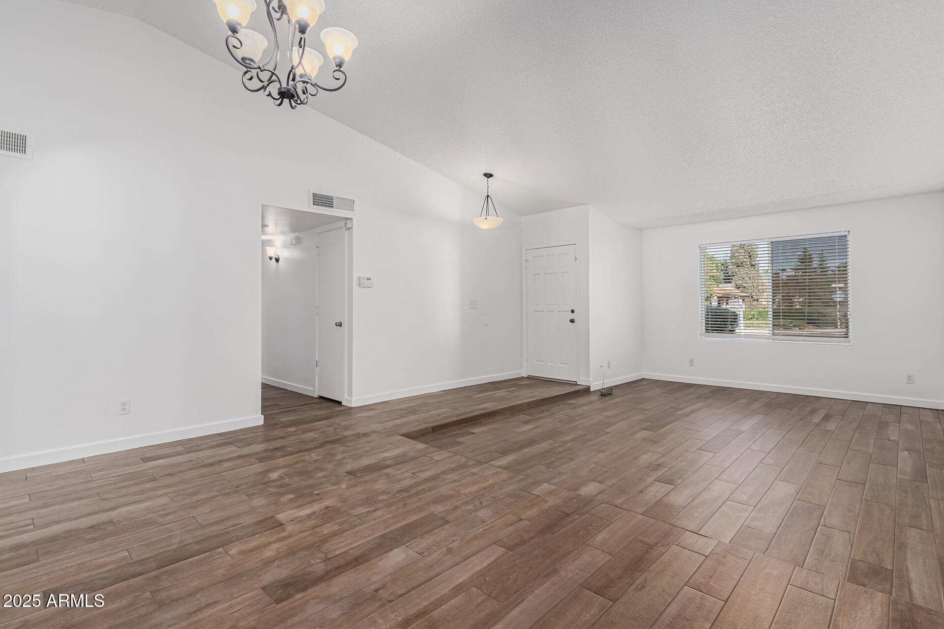 14034 North 60th Street Scottsdale, AZ 85254 - Photo 7 of 44 wooden floor in an empty room with a window
