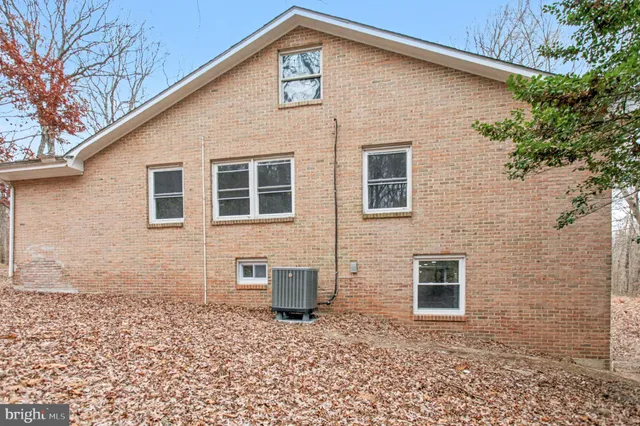 a pathway of a house with a yard