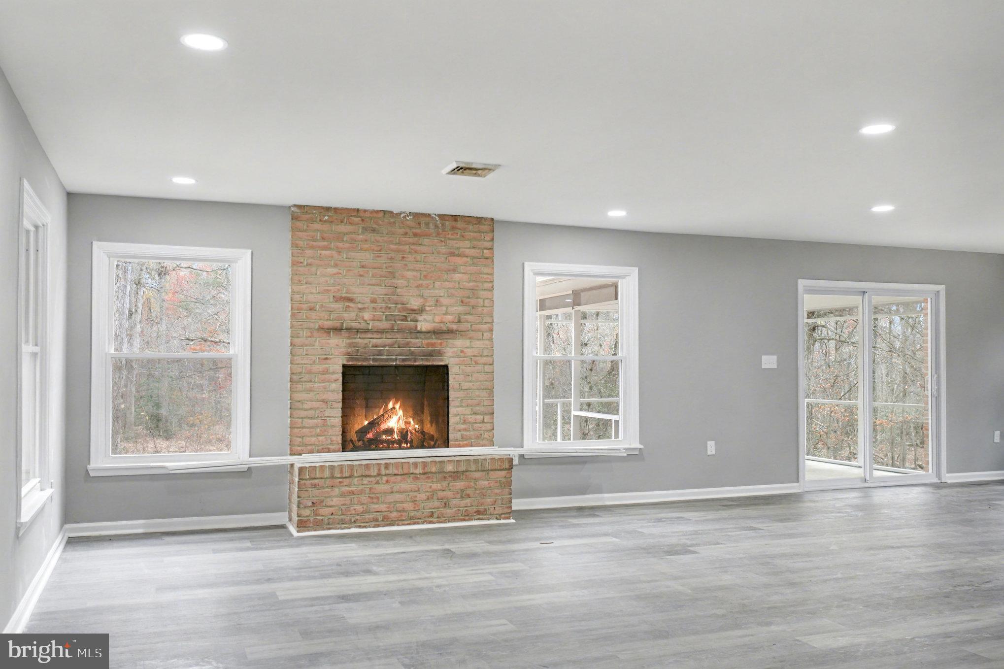 Garrett Court Elkton, MD 21921 - Photo 23 of 51 an empty room with windows and fireplace