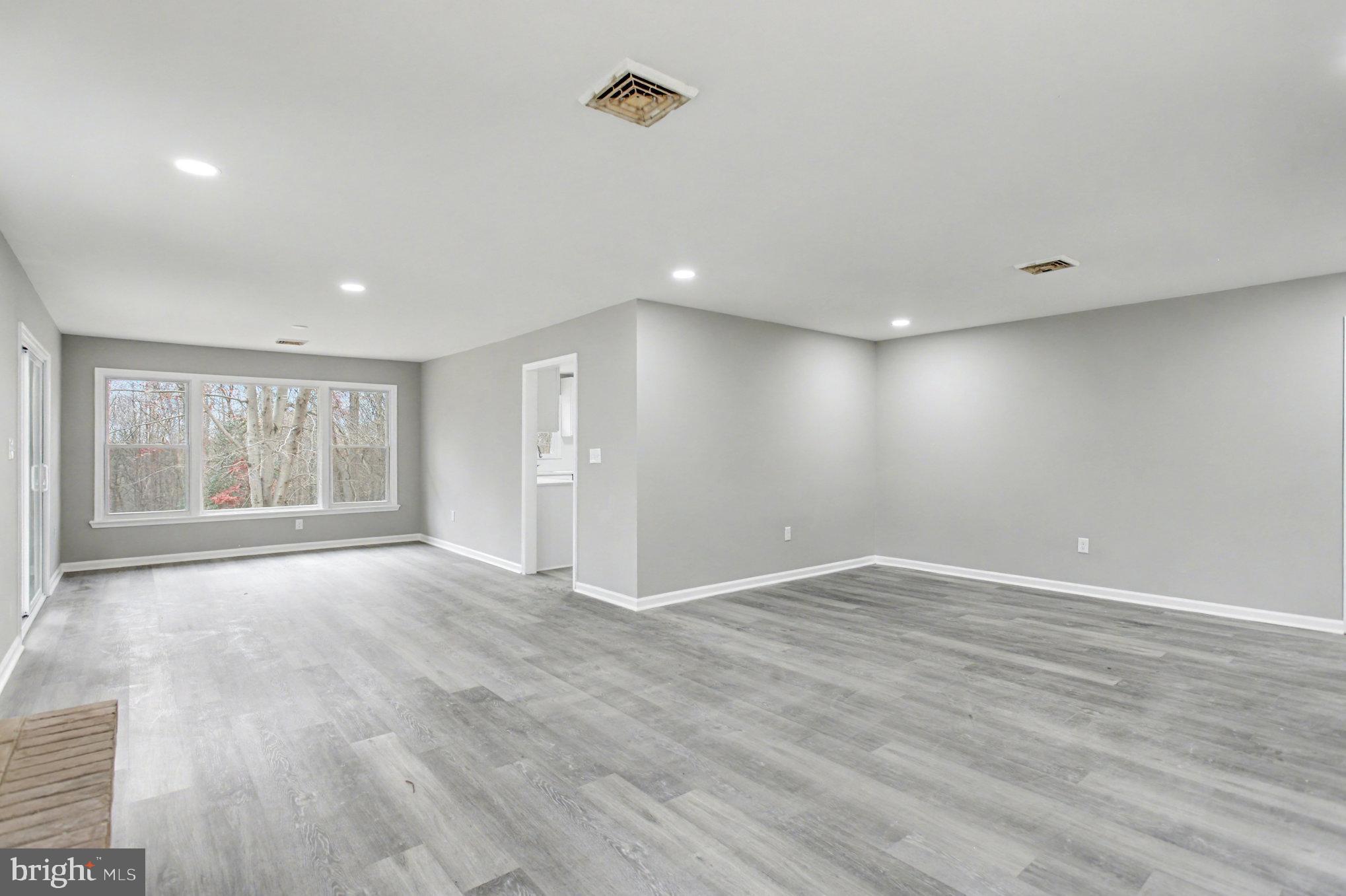 Garrett Court Elkton, MD 21921 - Photo 27 of 51 a view of an empty room with wooden floor and a window
