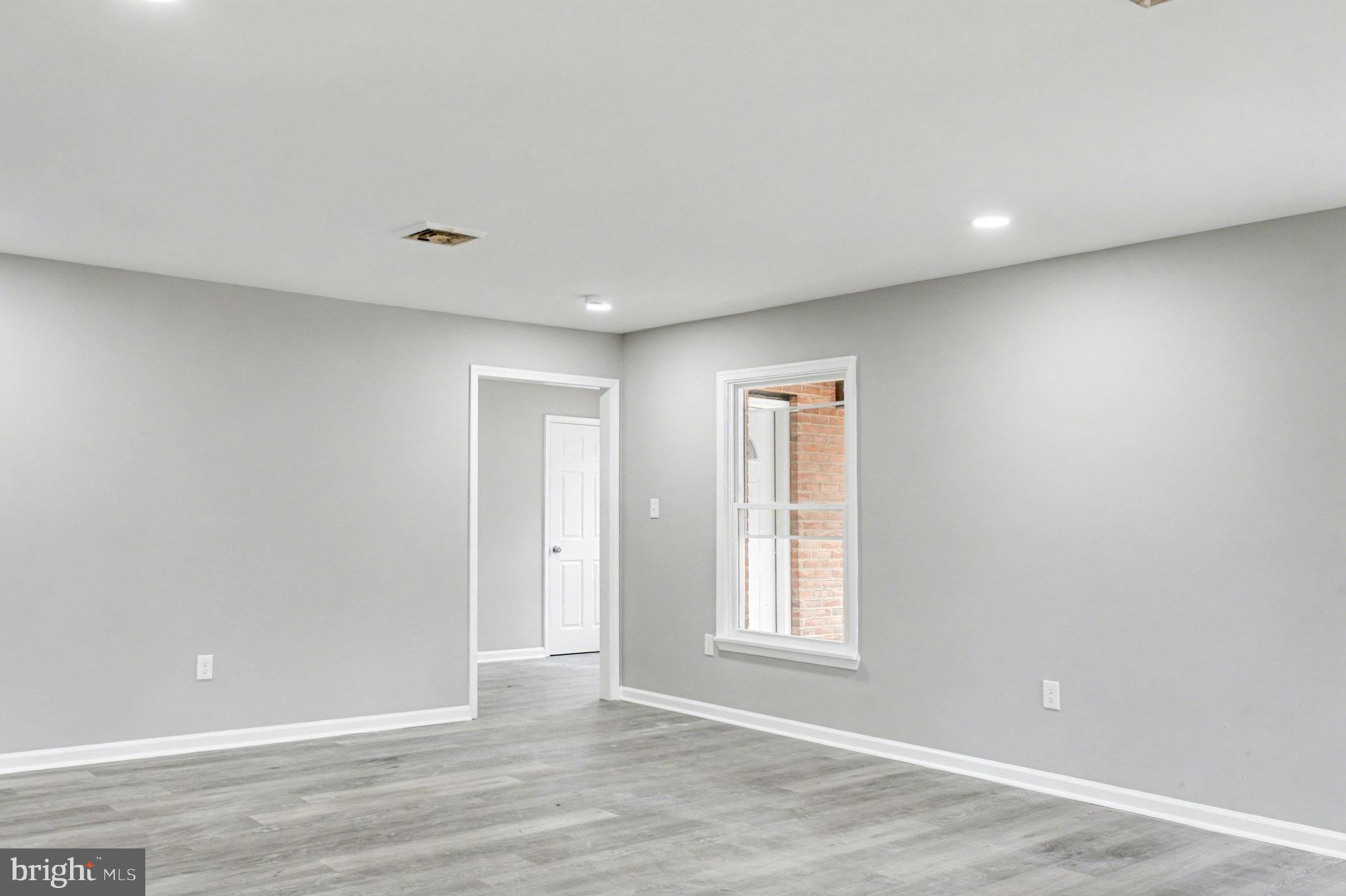Garrett Court Elkton, MD 21921 - Photo 30 of 51 an empty room with wooden floor and windows