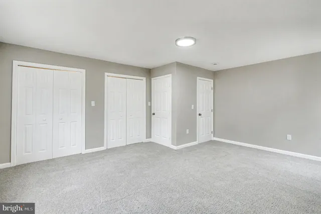 a bathroom with a bathtub shower sink vanity and toilet