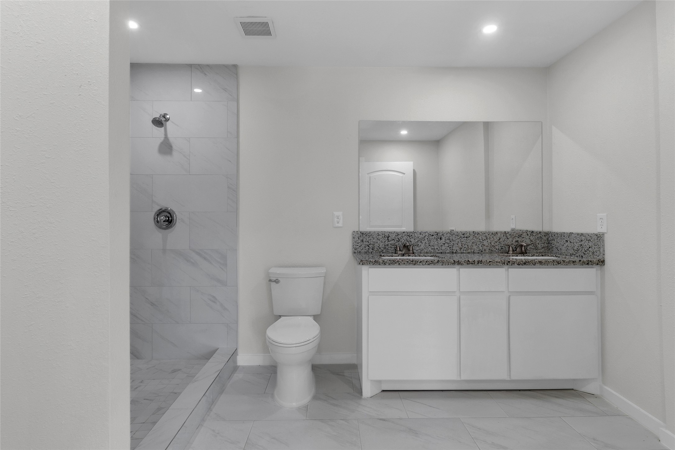 7622 Williams Street Houston, TX 77040 - Photo 18 of 42 a bathroom with a granite countertop sink a toilet and shower