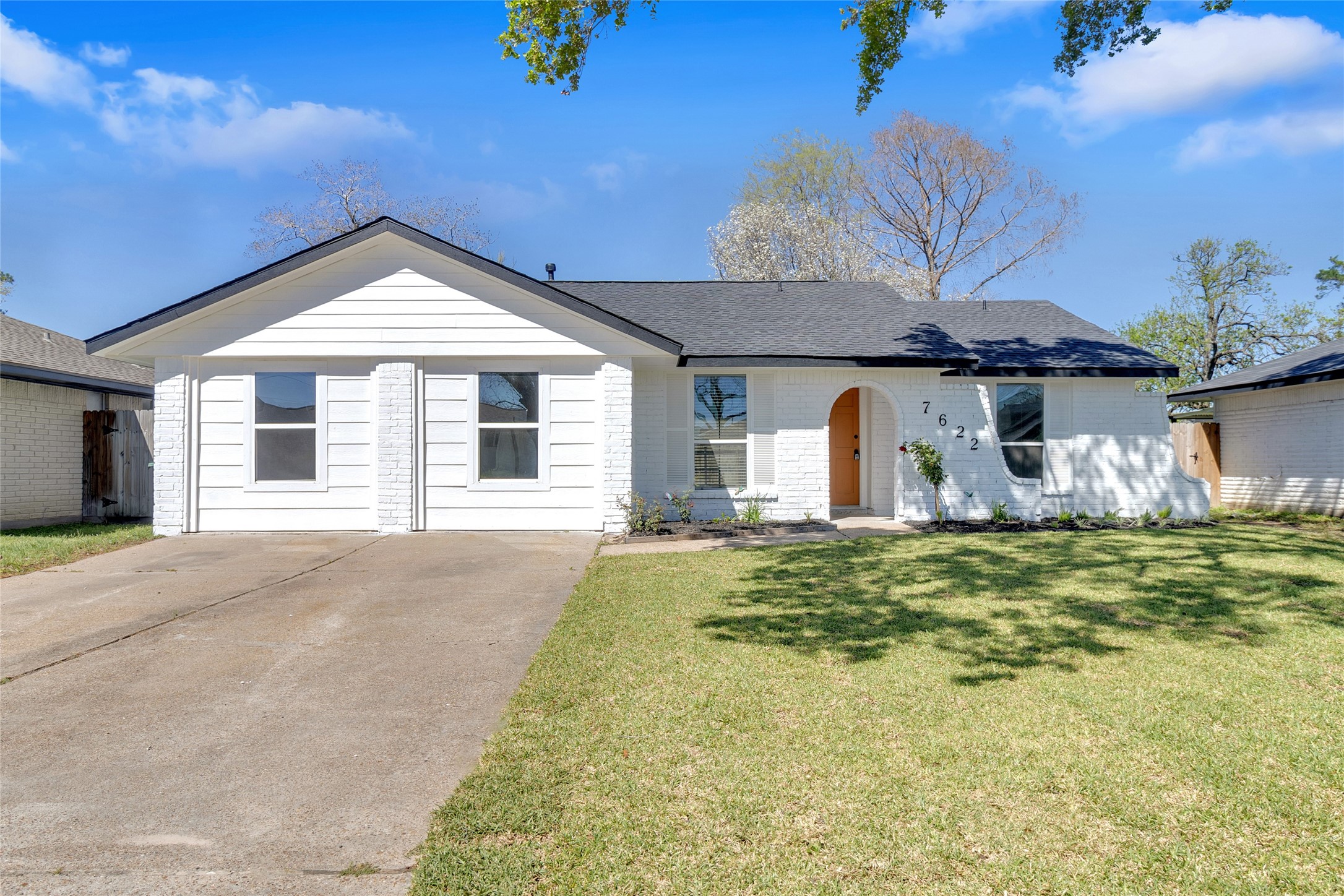 7622 Williams Street Houston, TX 77040 - Photo 2 of 42 a front view of a house with garden