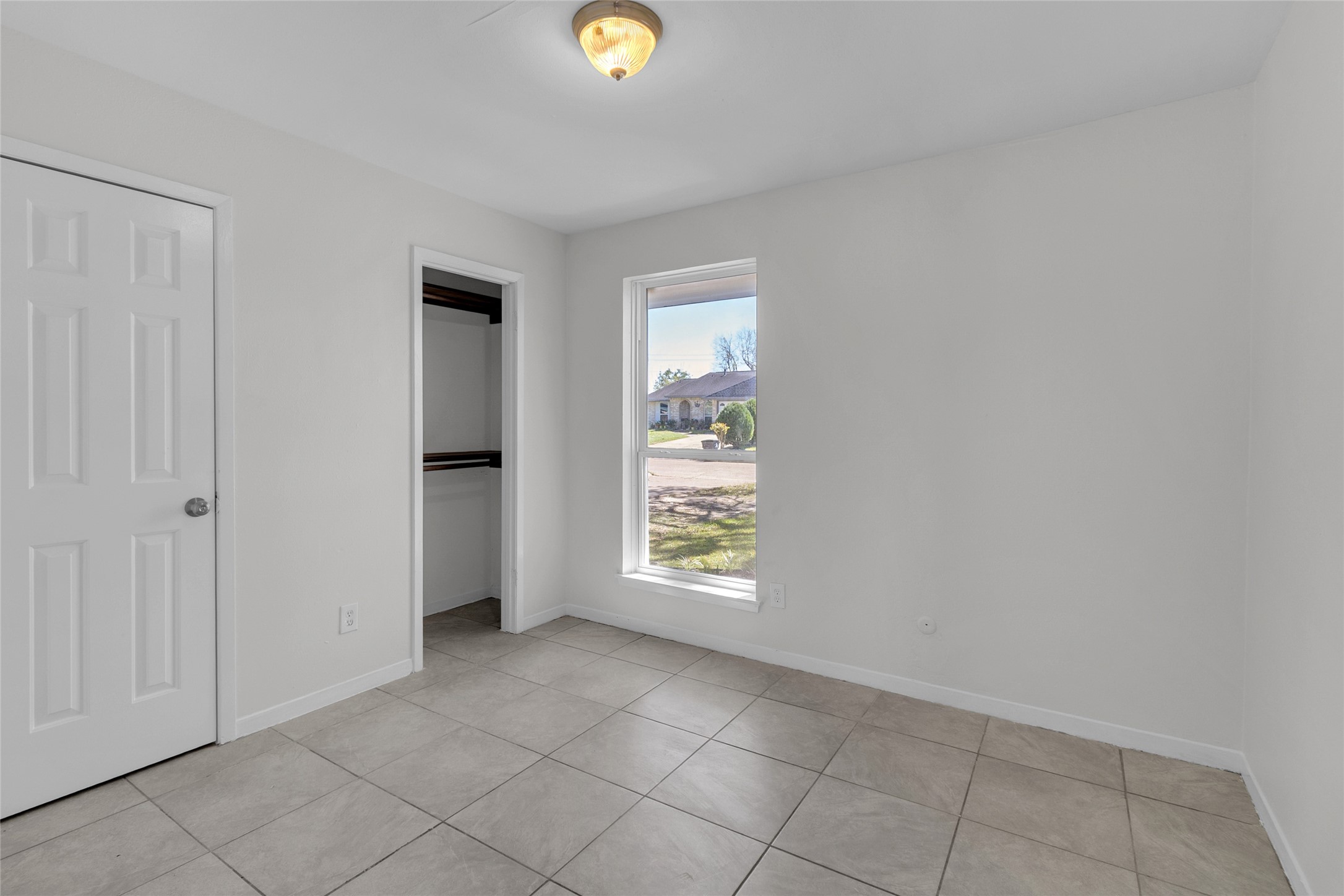 7622 Williams Street Houston, TX 77040 - Photo 26 of 42 an empty room with windows
