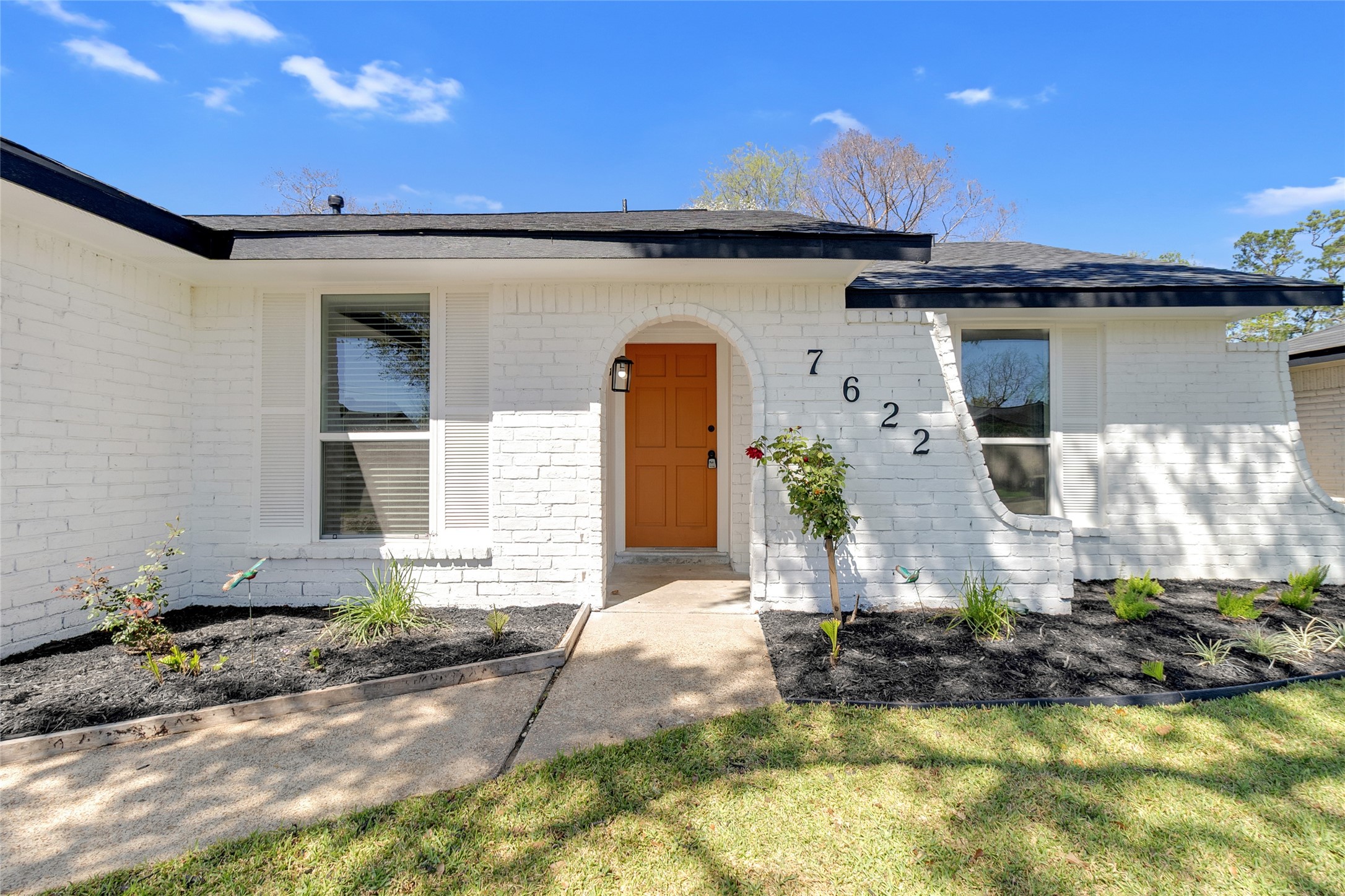 7622 Williams Street Houston, TX 77040 - Photo 3 of 42 a front view of a house with a yard