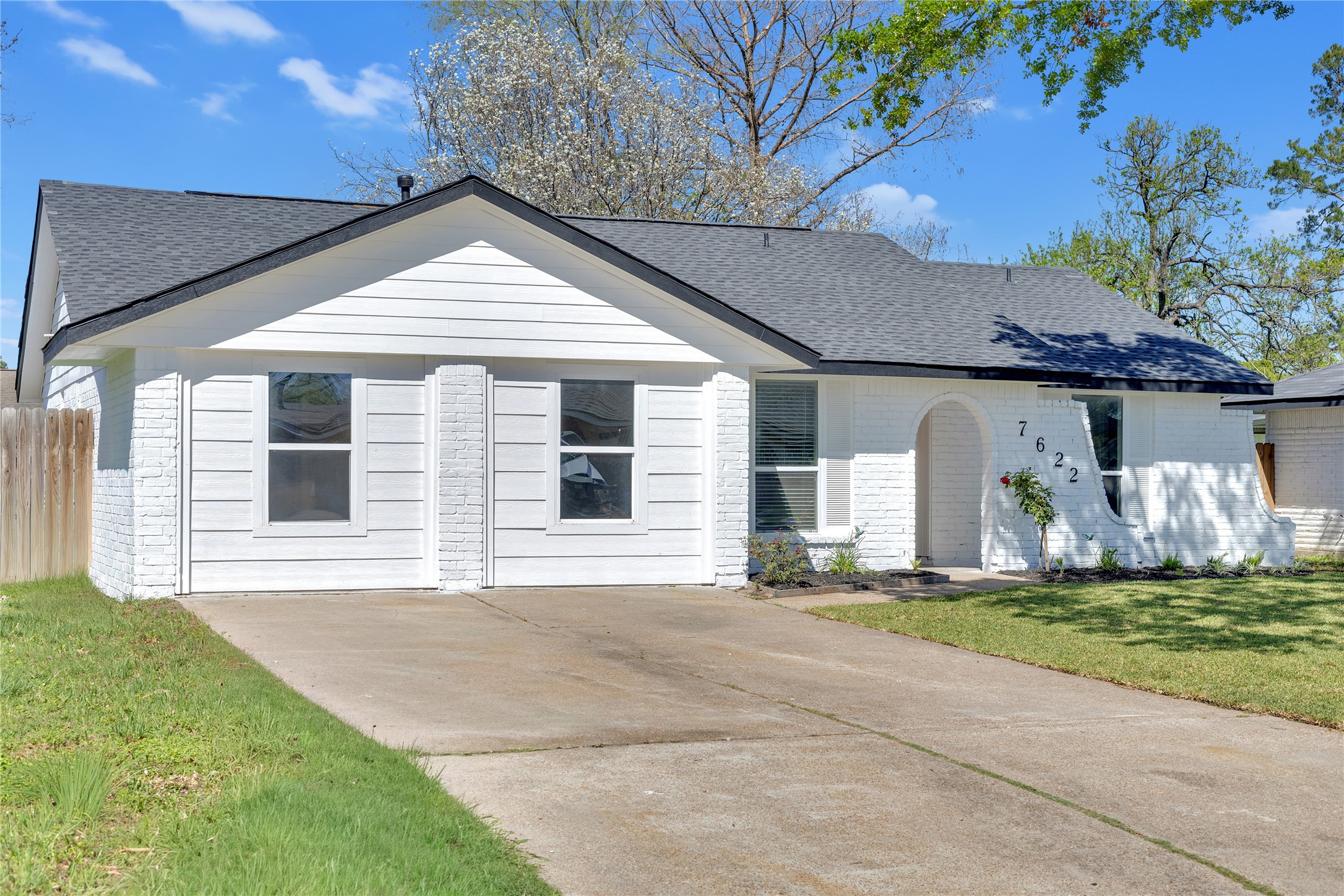 7622 Williams Street Houston, TX 77040 - Photo 42 of 42 a front view of a house with a yard and garage