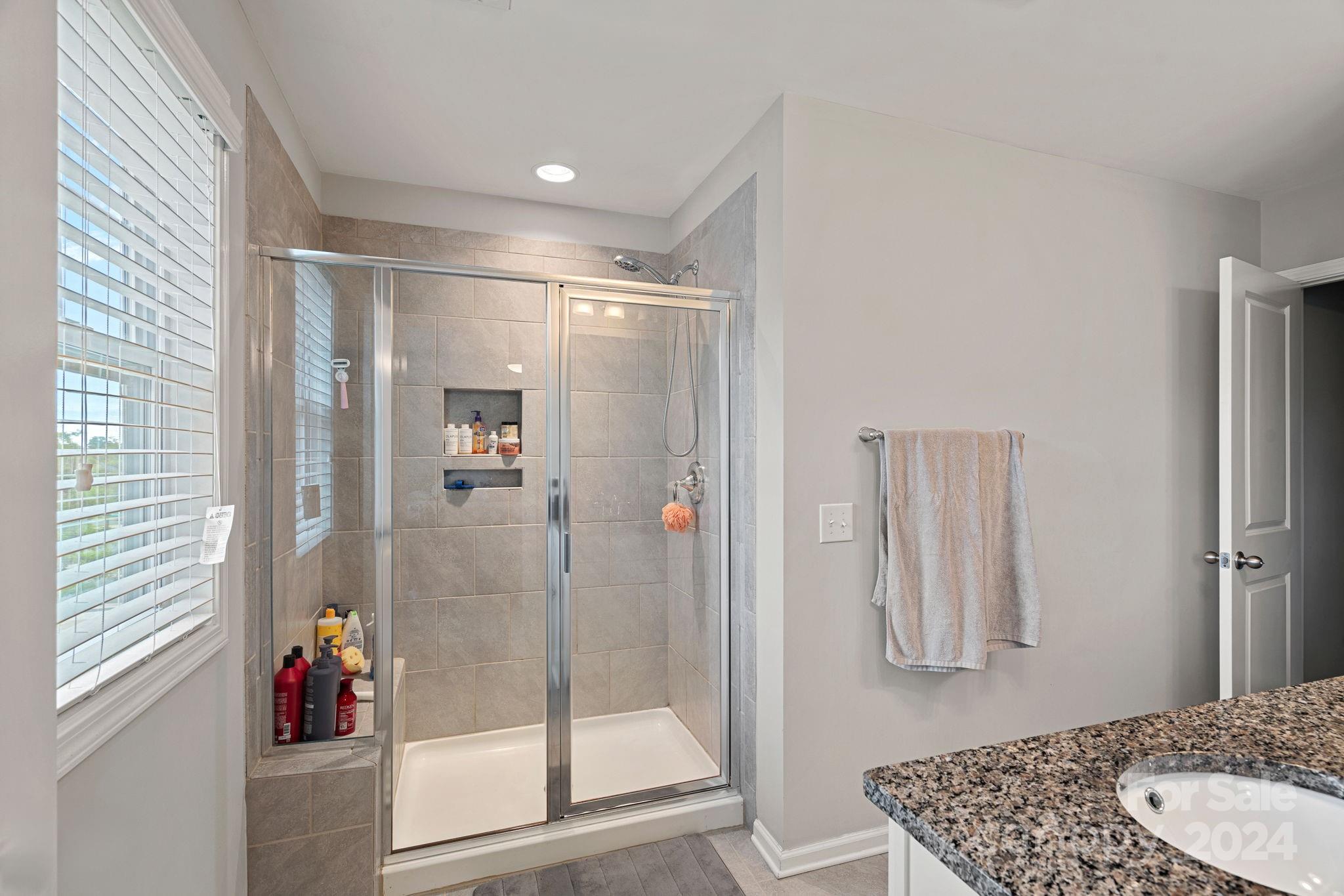 7044 Harris Bay Road Charlotte, NC 28269 - Photo 11 of 17 a bathroom with a shower