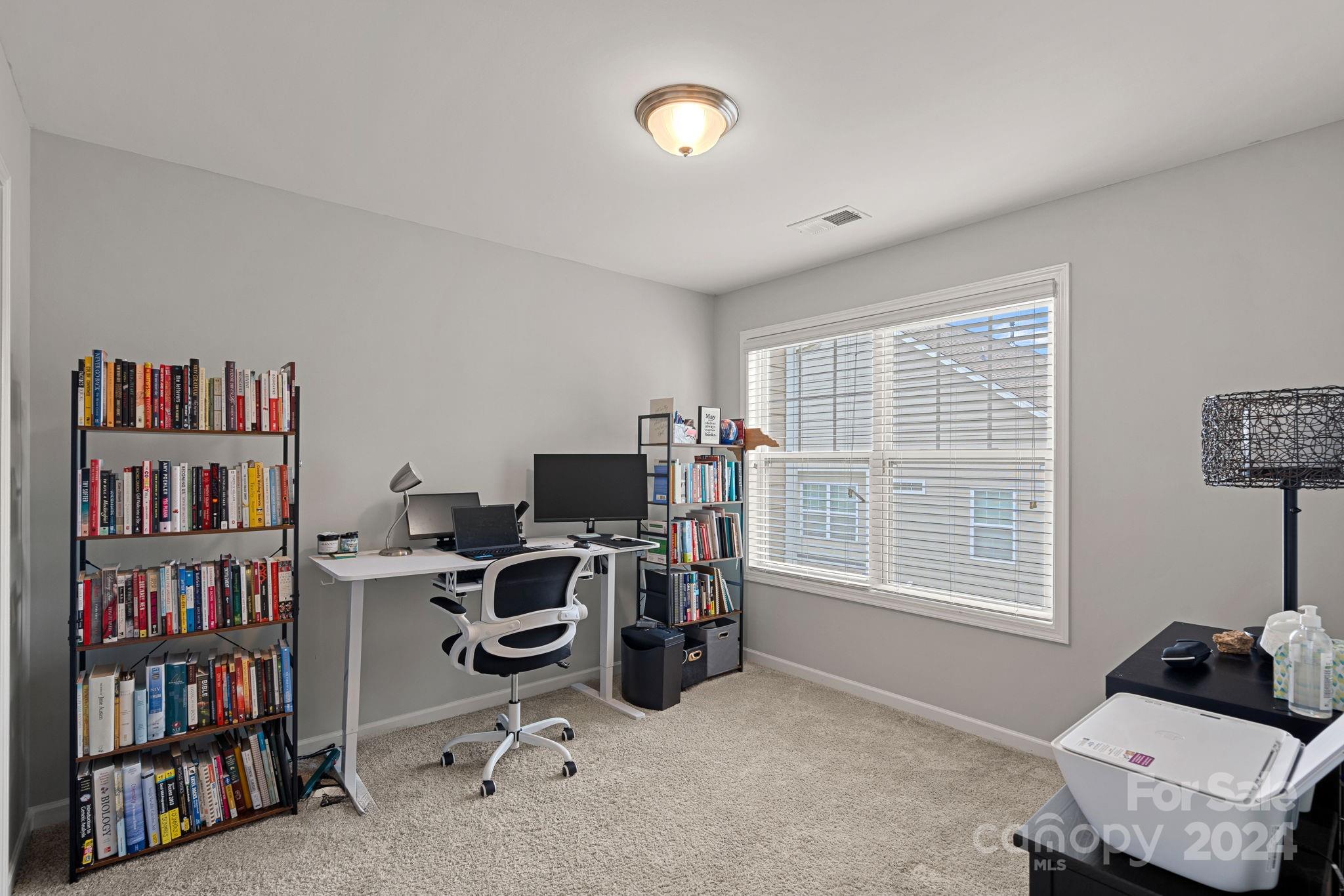 7044 Harris Bay Road Charlotte, NC 28269 - Photo 14 of 17 a workspace with a window and a couch