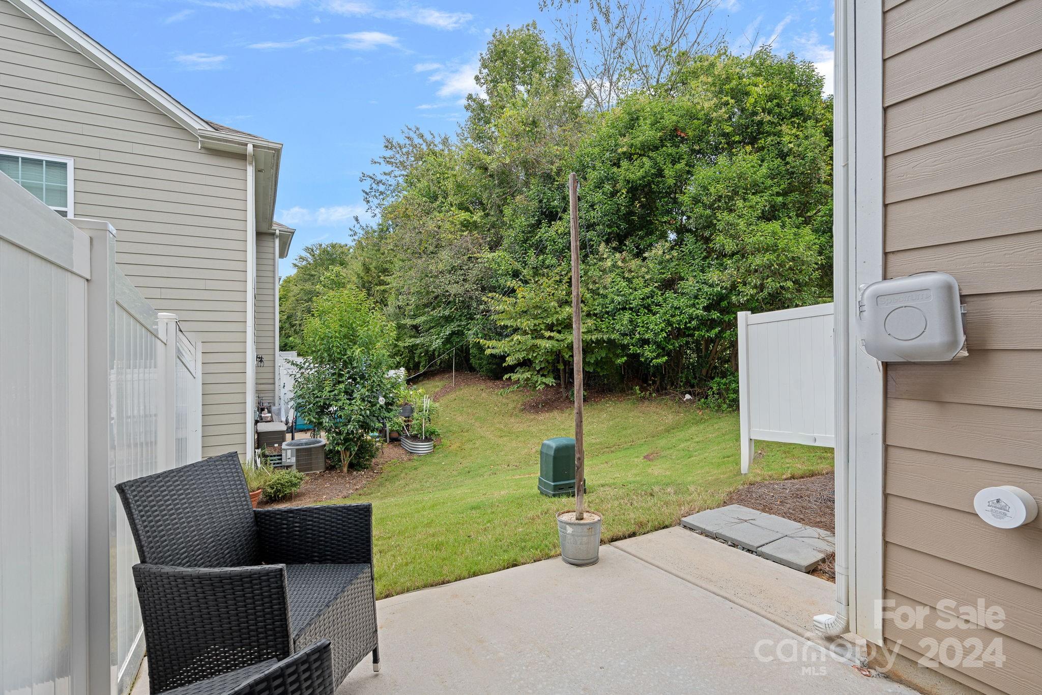 7044 Harris Bay Road Charlotte, NC 28269 - Photo 16 of 17 a view of backyard with seating space