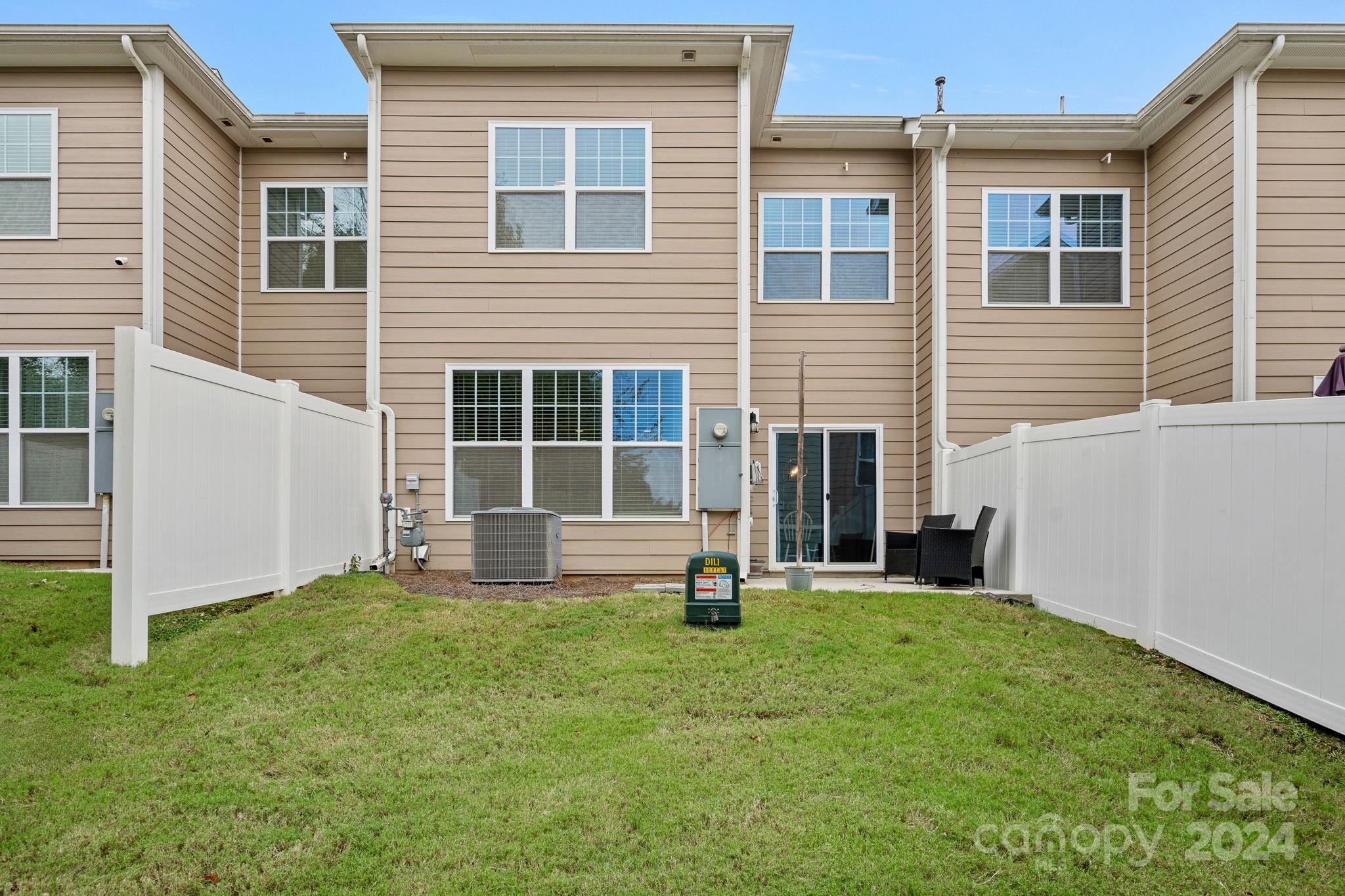 7044 Harris Bay Road Charlotte, NC 28269 - Photo 17 of 17 a view of a house with backyard and porch