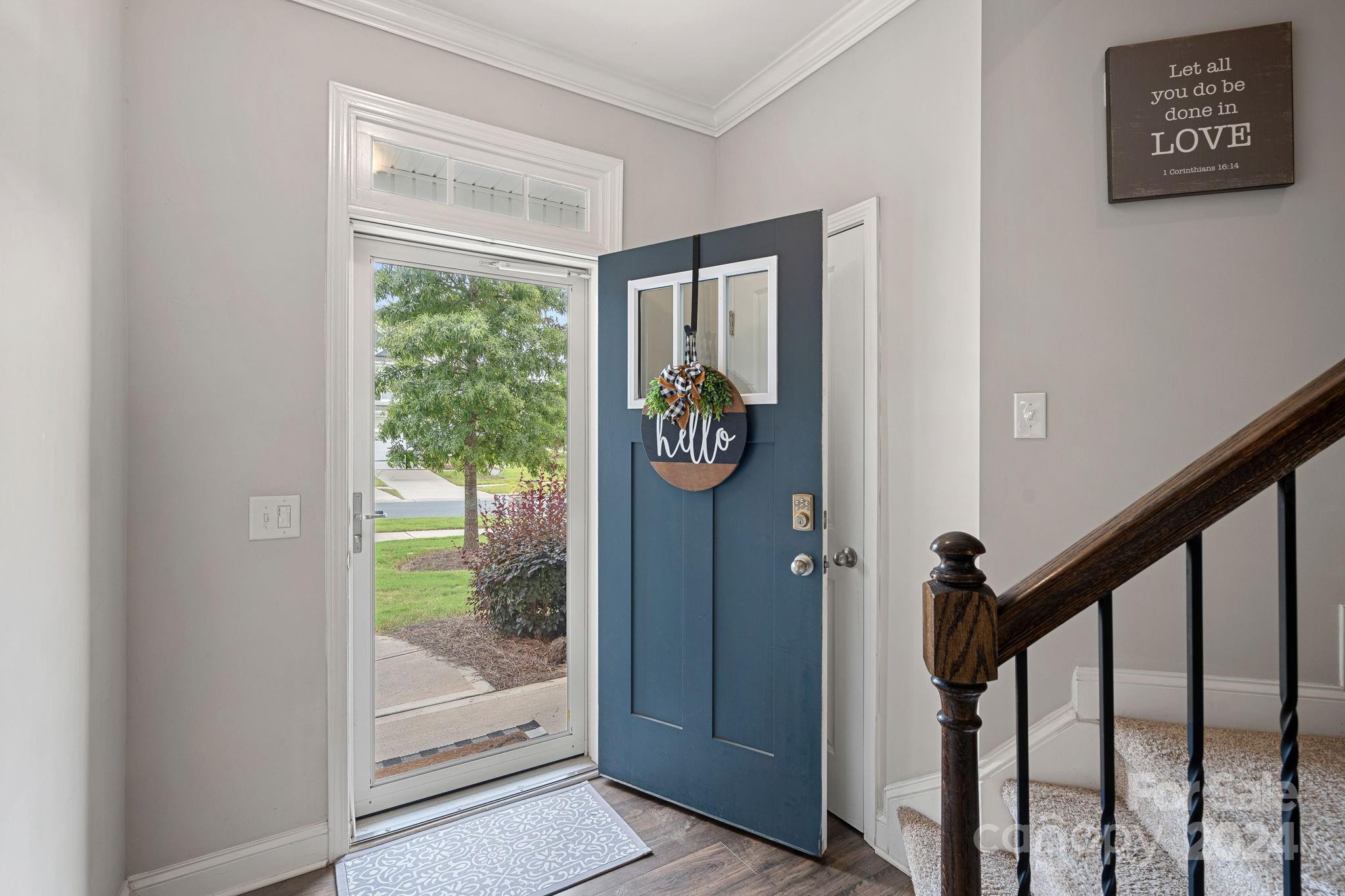 7044 Harris Bay Road Charlotte, NC 28269 - Photo 2 of 17 a view of an entryway with wooden floor