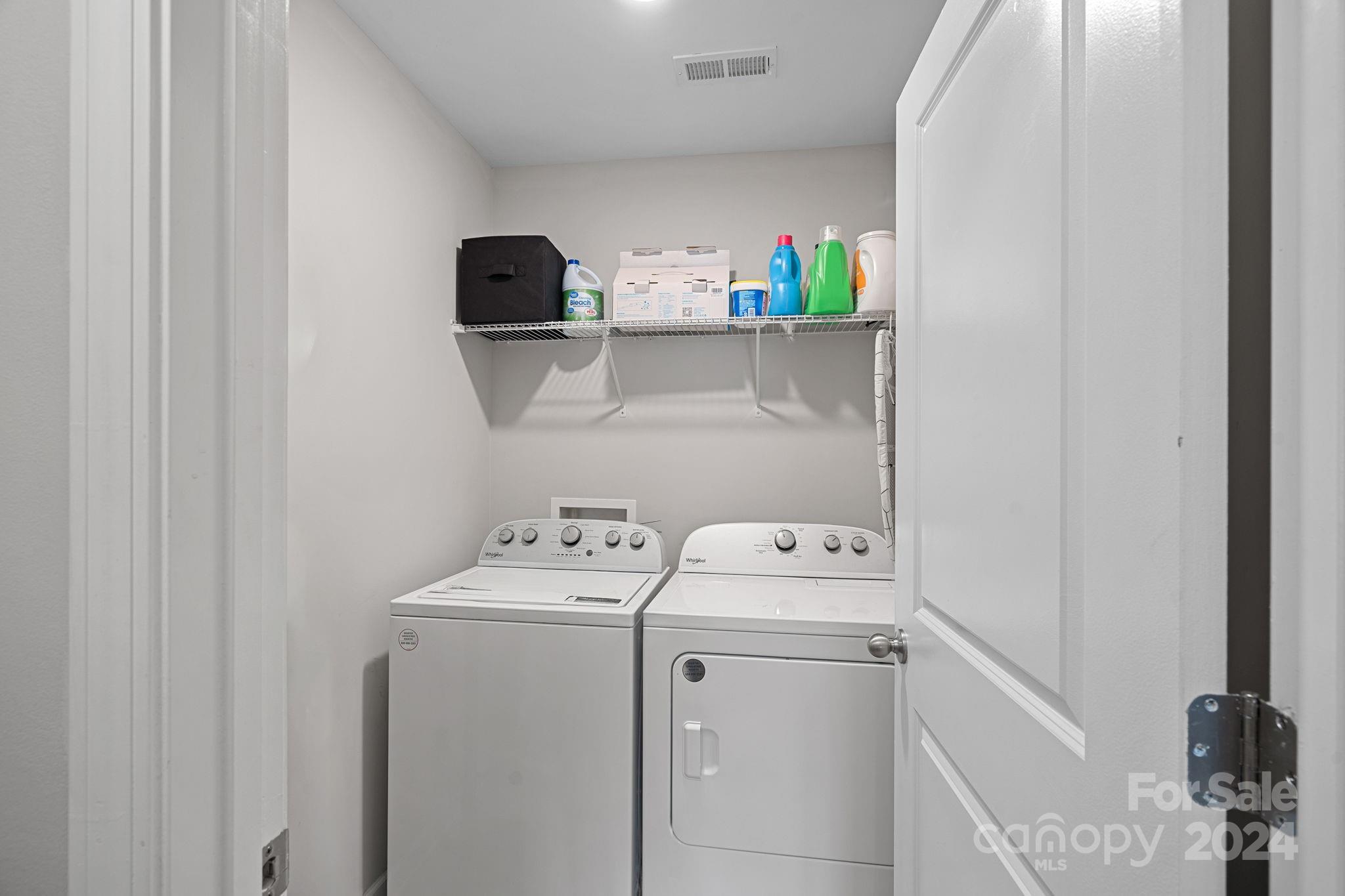 7044 Harris Bay Road Charlotte, NC 28269 - Photo 9 of 17 a utility room with dryer and washer