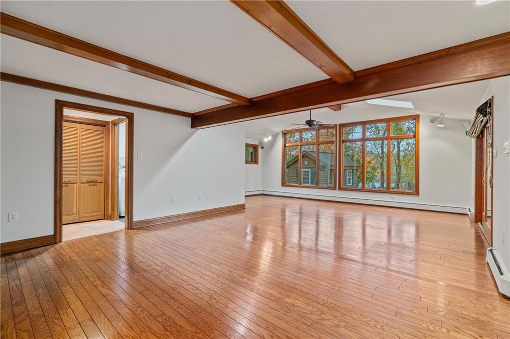 126 Rockingham Lane Canonsburg, PA 15317 - Photo 11 of 44 a view of an empty room with wooden floor and a window