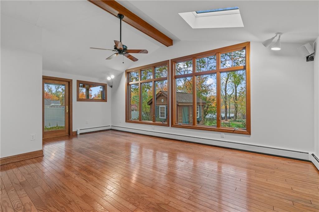 126 Rockingham Lane Canonsburg, PA 15317 - Photo 13 of 44 a view of an empty room with window and wooden floor