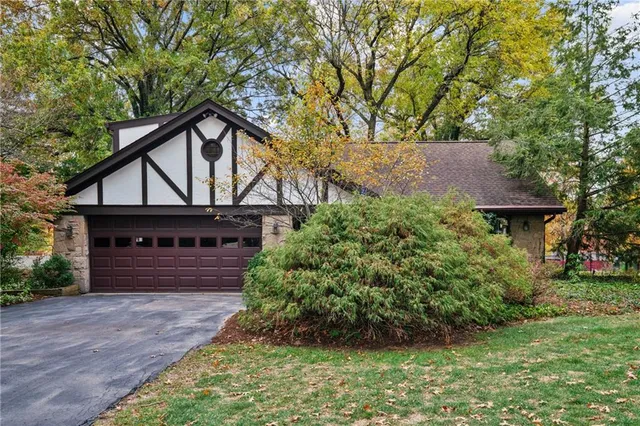 front view of a house with a small yard