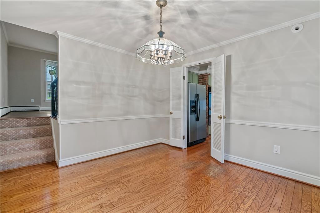 126 Rockingham Lane Canonsburg, PA 15317 - Photo 6 of 44 a view of an empty room with wooden floor and a window