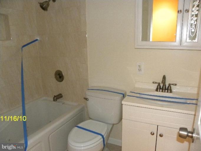 2724 2nd Street Southeast Washington, DC 20032 - Photo 4 of 4 a bathroom with a sink a toilet and shower