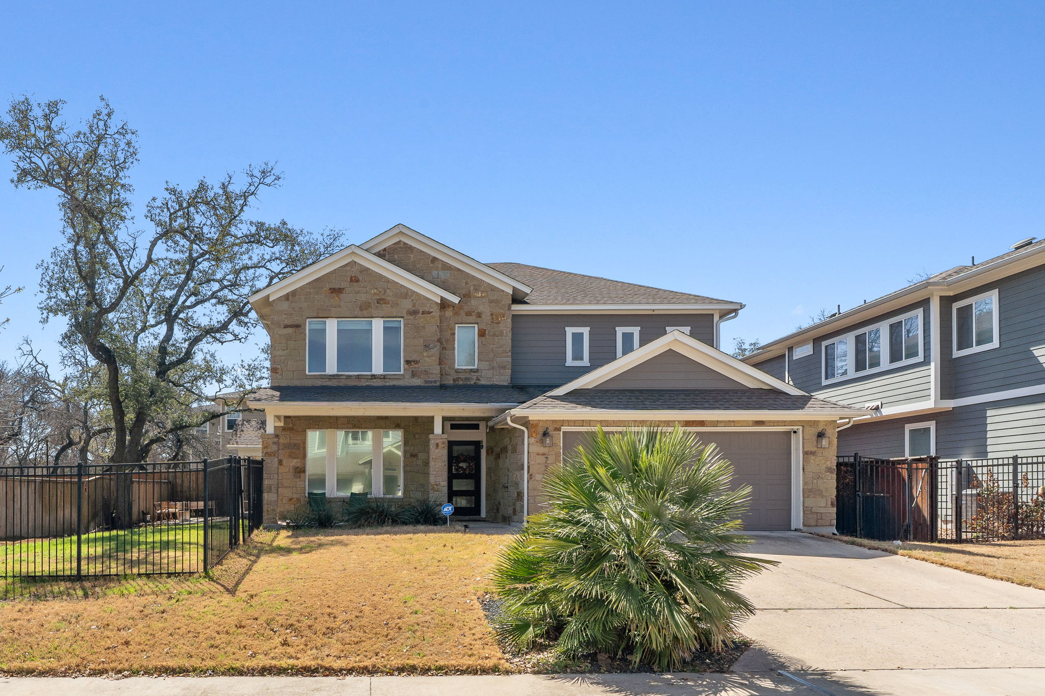 7205 Albert Road Austin, TX 78745 - Photo 1 of 37 a front view of a house with garden