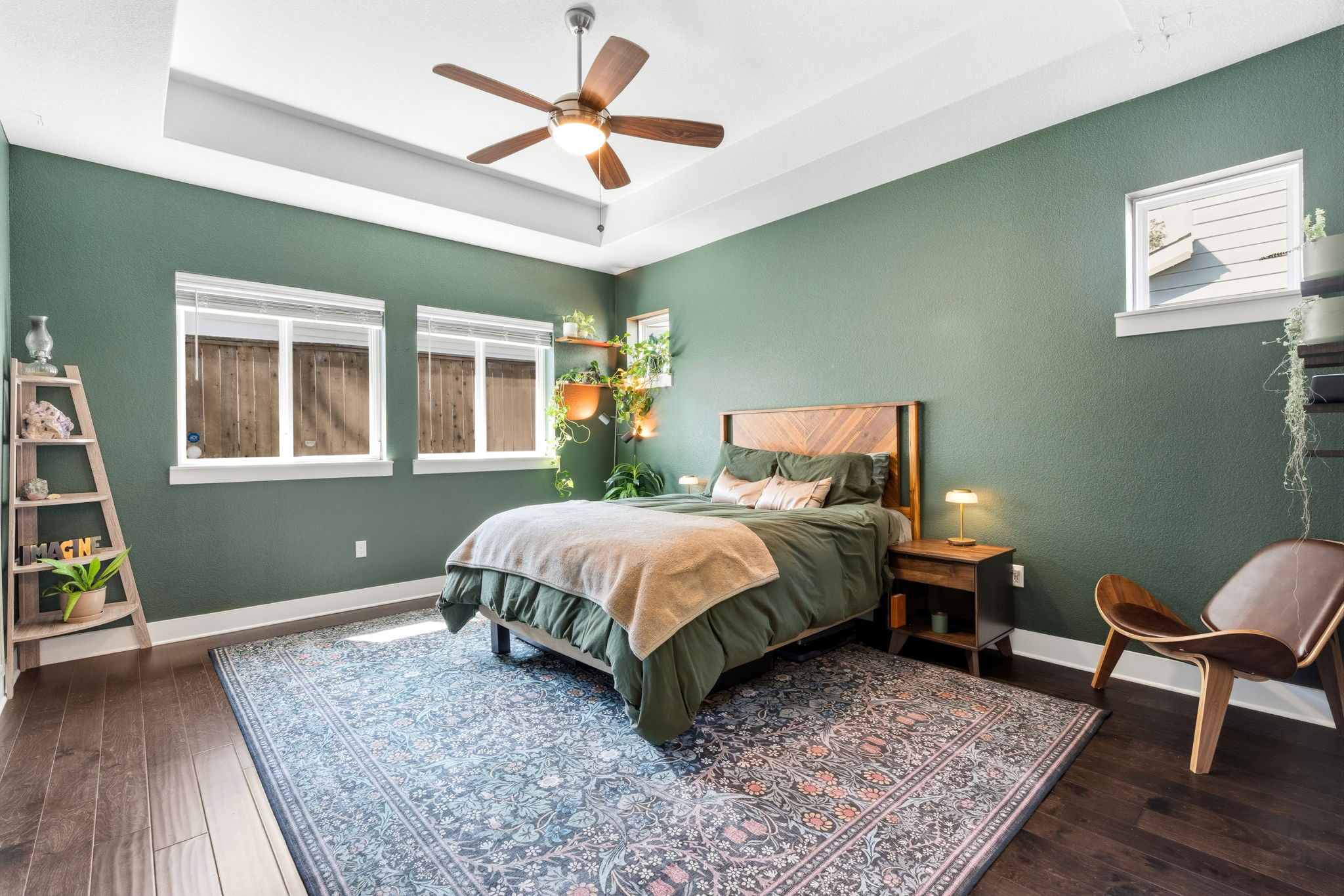 7205 Albert Road Austin, TX 78745 - Photo 17 of 37 a spacious bedroom with a bed a dresser and wooden floor