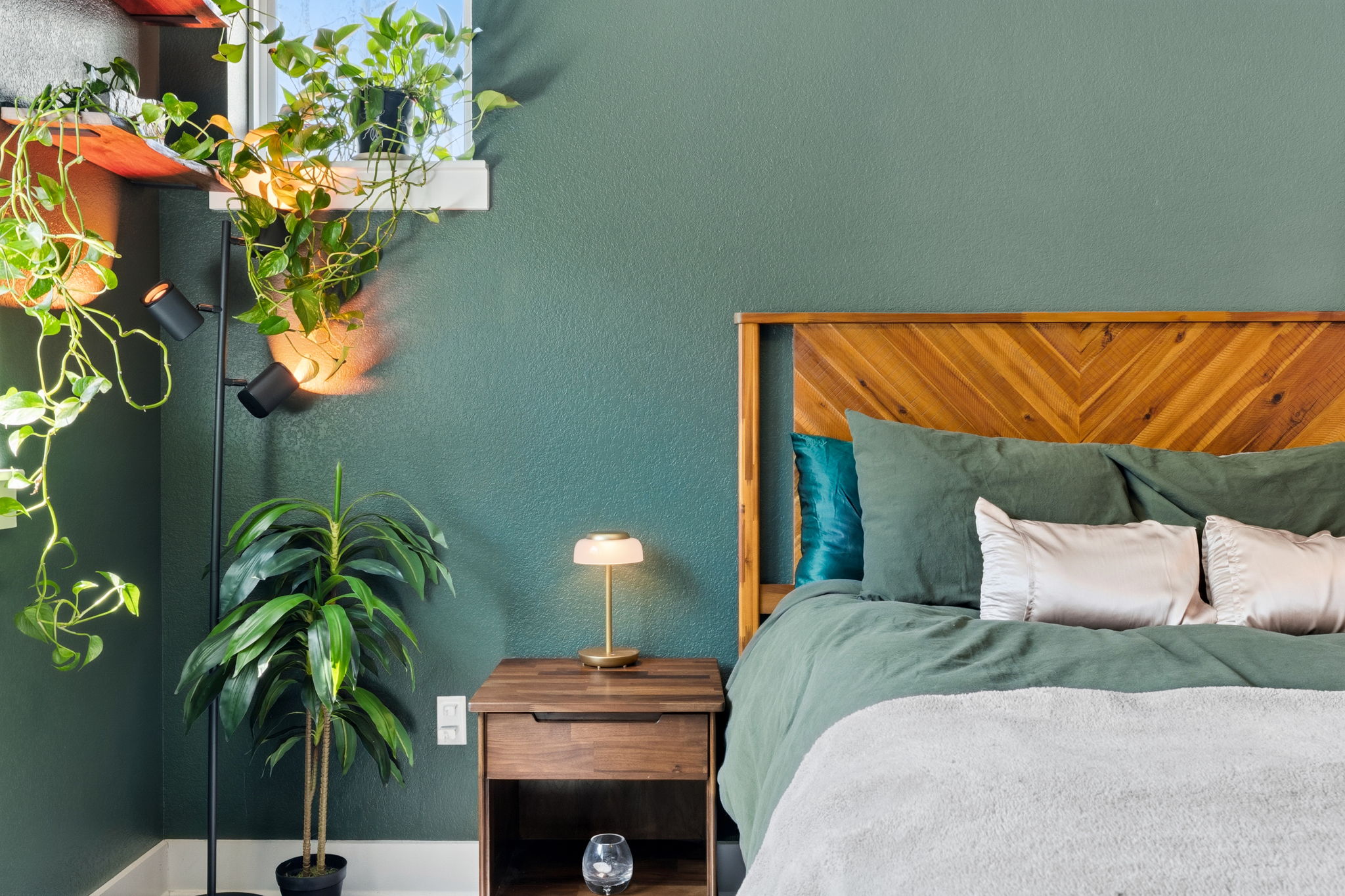 7205 Albert Road Austin, TX 78745 - Photo 18 of 37 a bedroom with a bed and a potted plant