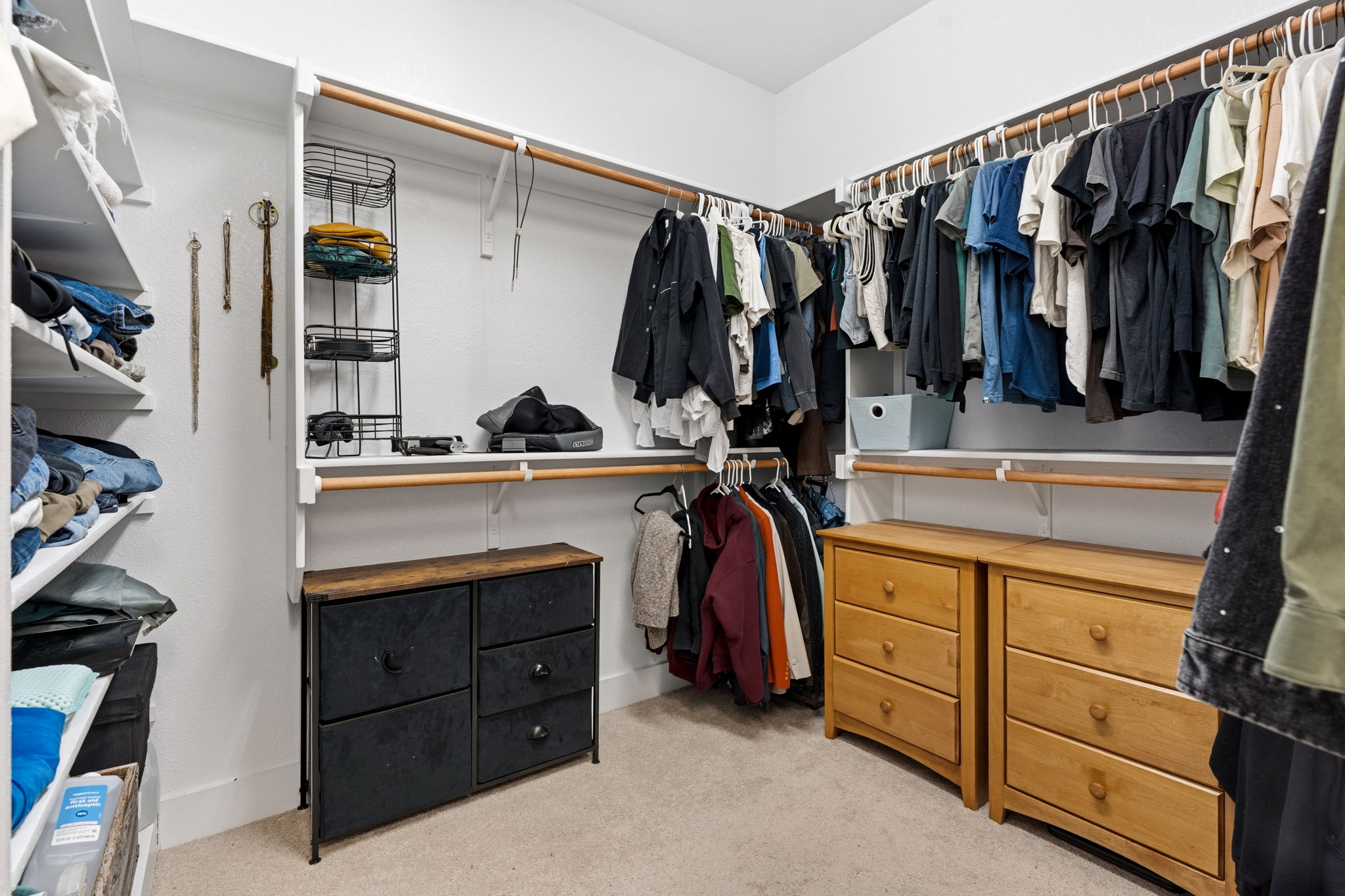 7205 Albert Road Austin, TX 78745 - Photo 23 of 37 a view of walk in closet with clothes and shoes