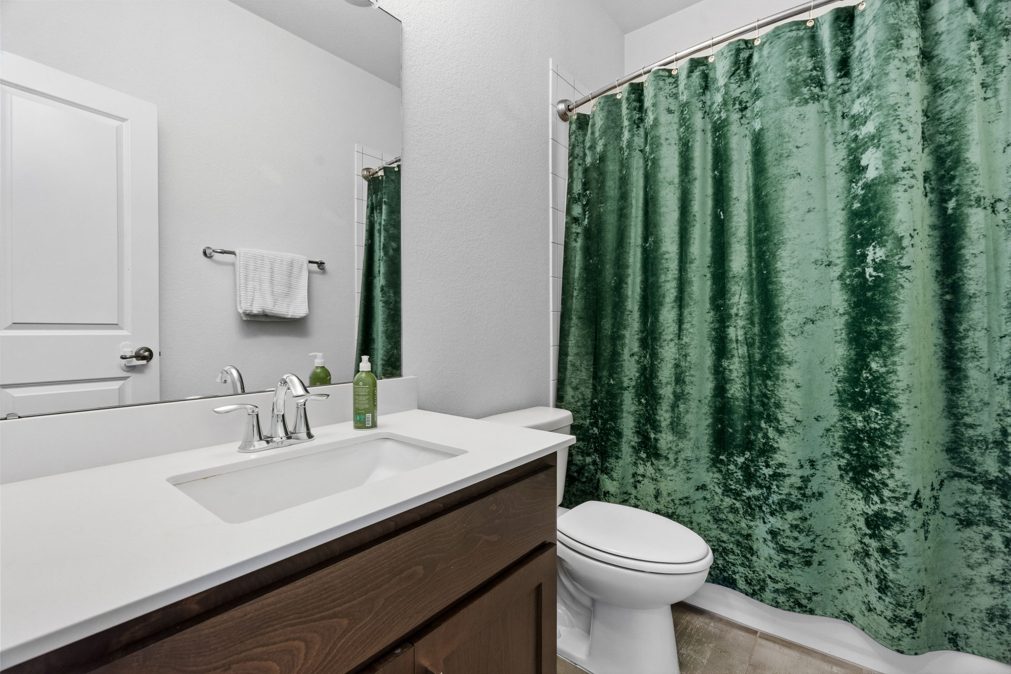 7205 Albert Road Austin, TX 78745 - Photo 30 of 37 a bathroom with a sink a toilet and mirror