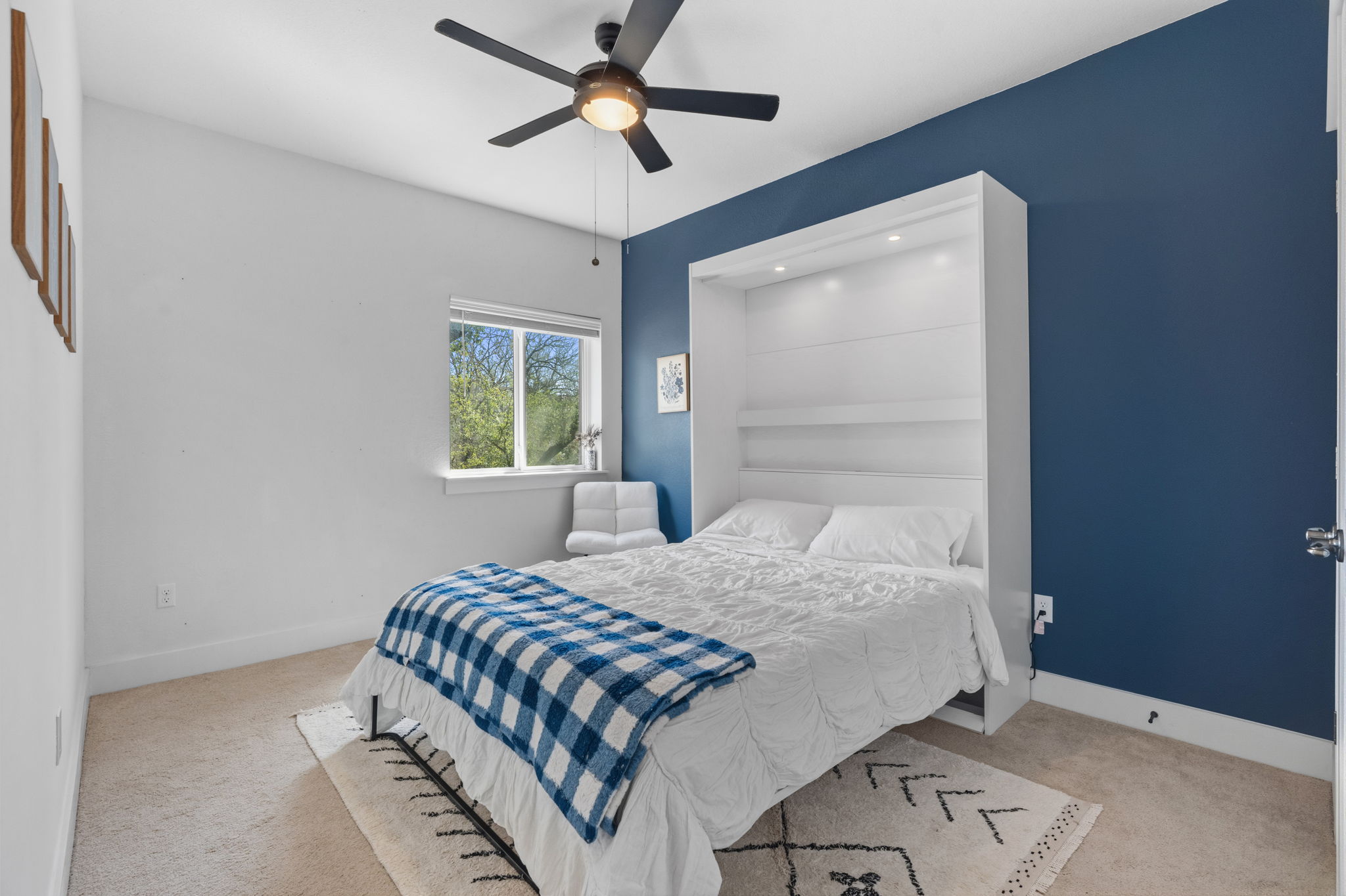 7205 Albert Road Austin, TX 78745 - Photo 32 of 37 a bedroom with a bed and a window