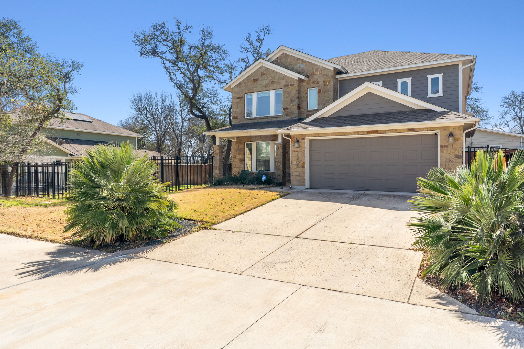7205 Albert Road Austin, TX 78745 - Photo 37 of 37 a front view of a house with a yard and potted plants