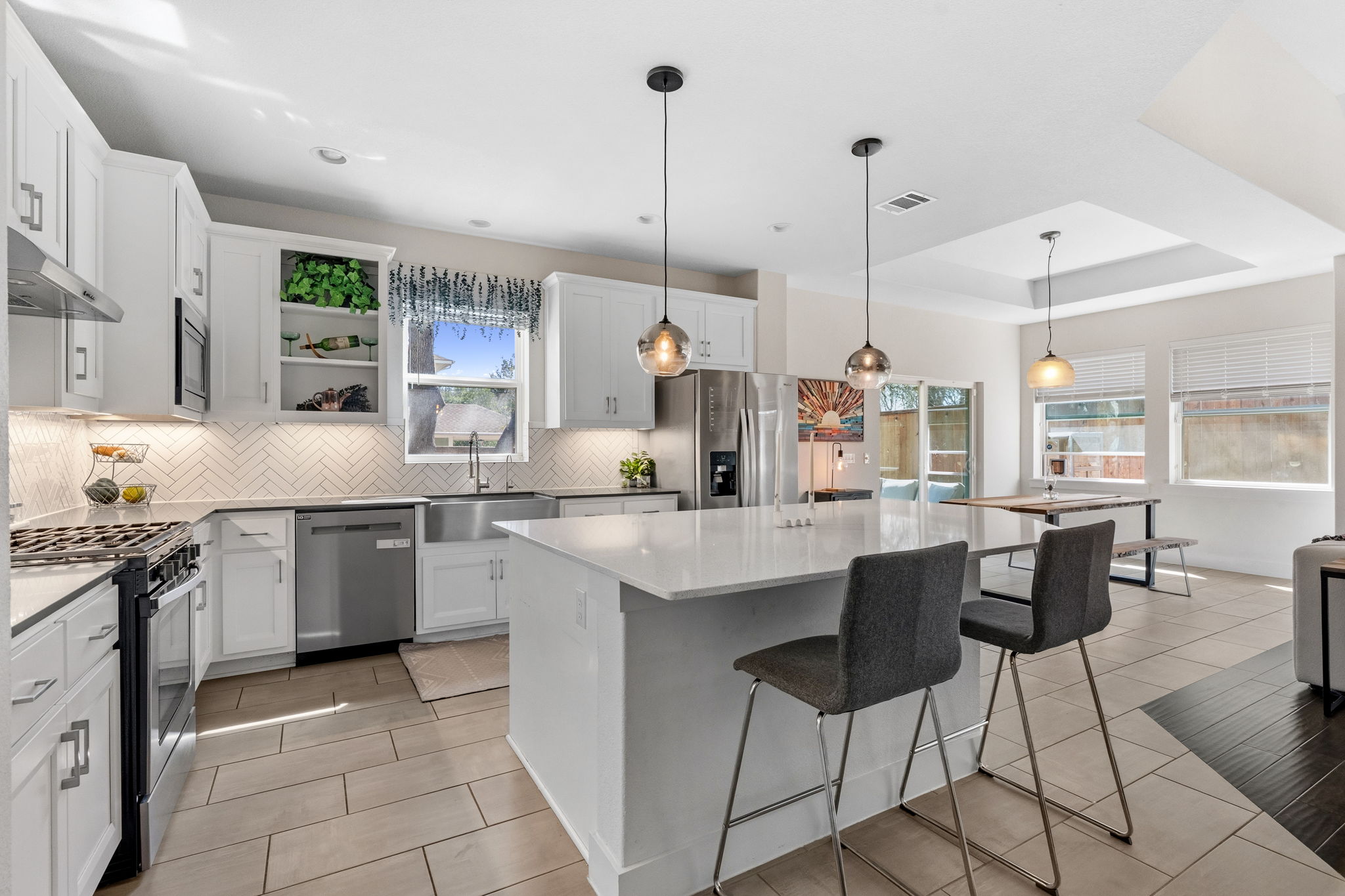 7205 Albert Road Austin, TX 78745 - Photo 8 of 37 a kitchen with stainless steel appliances granite countertop a sink and cabinets