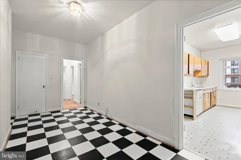 a view of a bathroom with a sink and a mirror