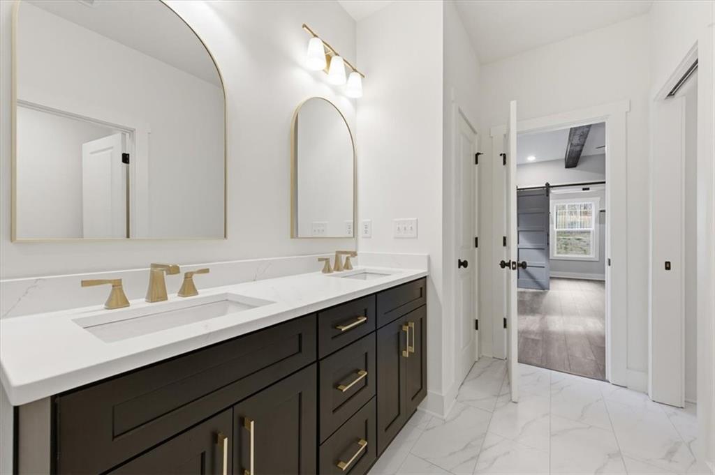 139 Old Alabama Road Southeast Emerson, GA 30137 - Photo 19 of 50 a spacious bathroom with a double vanity sink mirror and double