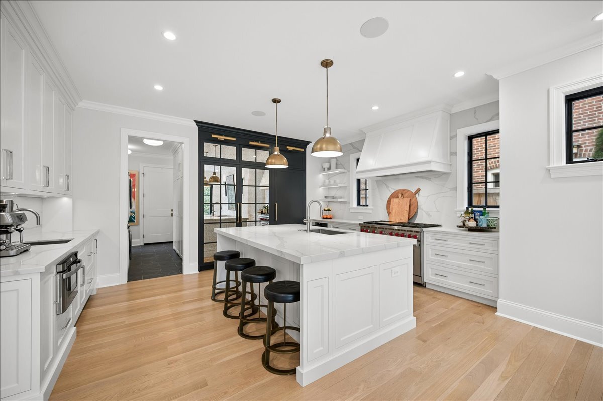 525 Ash Street Winnetka, IL 60093 - Photo 15 of 56 a kitchen with a stove a refrigerator and a sink