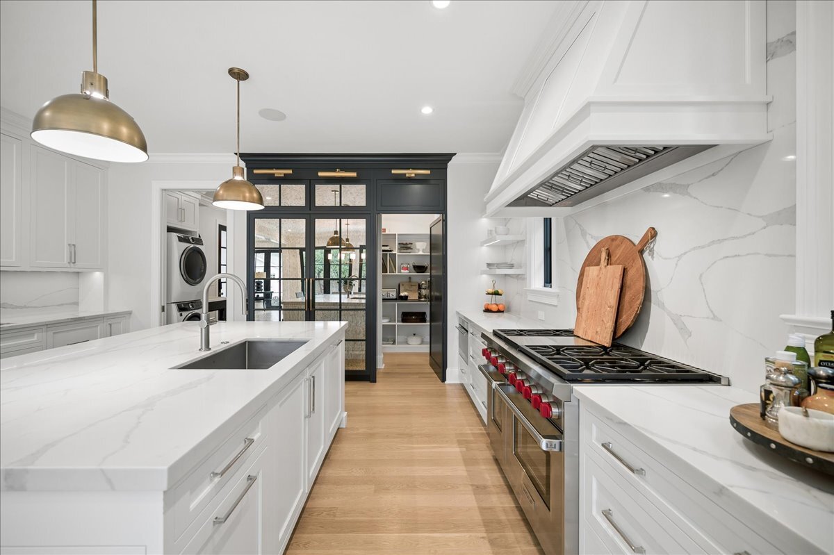 525 Ash Street Winnetka, IL 60093 - Photo 19 of 56 a kitchen with stainless steel appliances granite countertop a stove and a sink