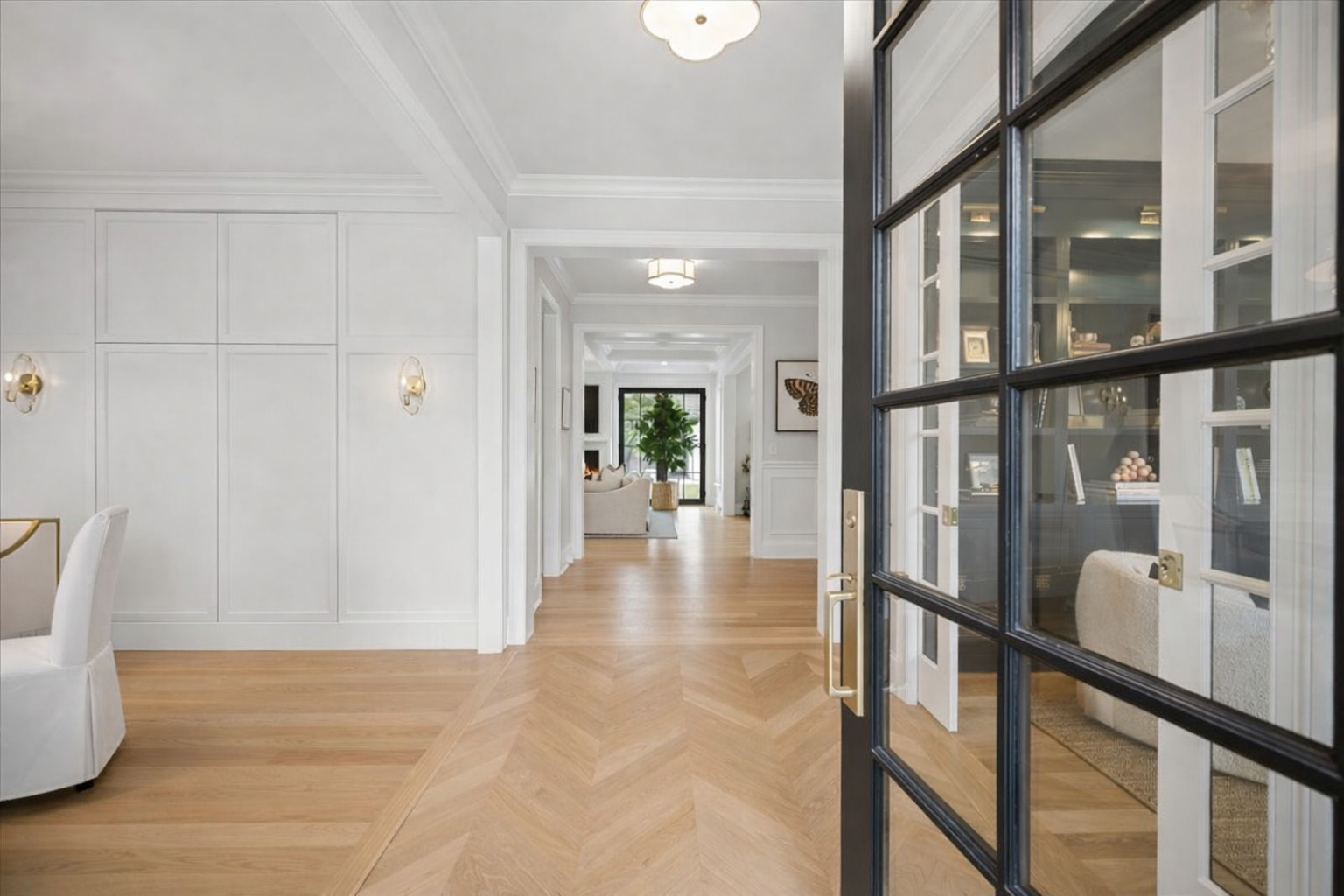 525 Ash Street Winnetka, IL 60093 - Photo 2 of 56 a view of a hallway with wooden floor and seating space