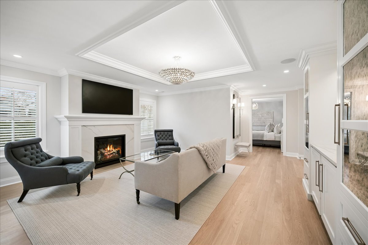 525 Ash Street Winnetka, IL 60093 - Photo 23 of 56 a living room with furniture and a fireplace