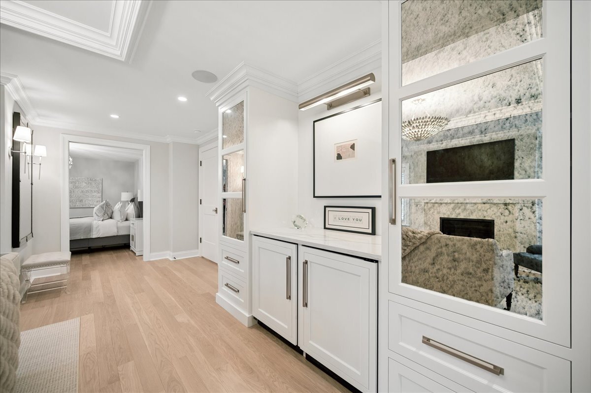 525 Ash Street Winnetka, IL 60093 - Photo 25 of 56 a bathroom with a balcony a bed and a flat screen tv