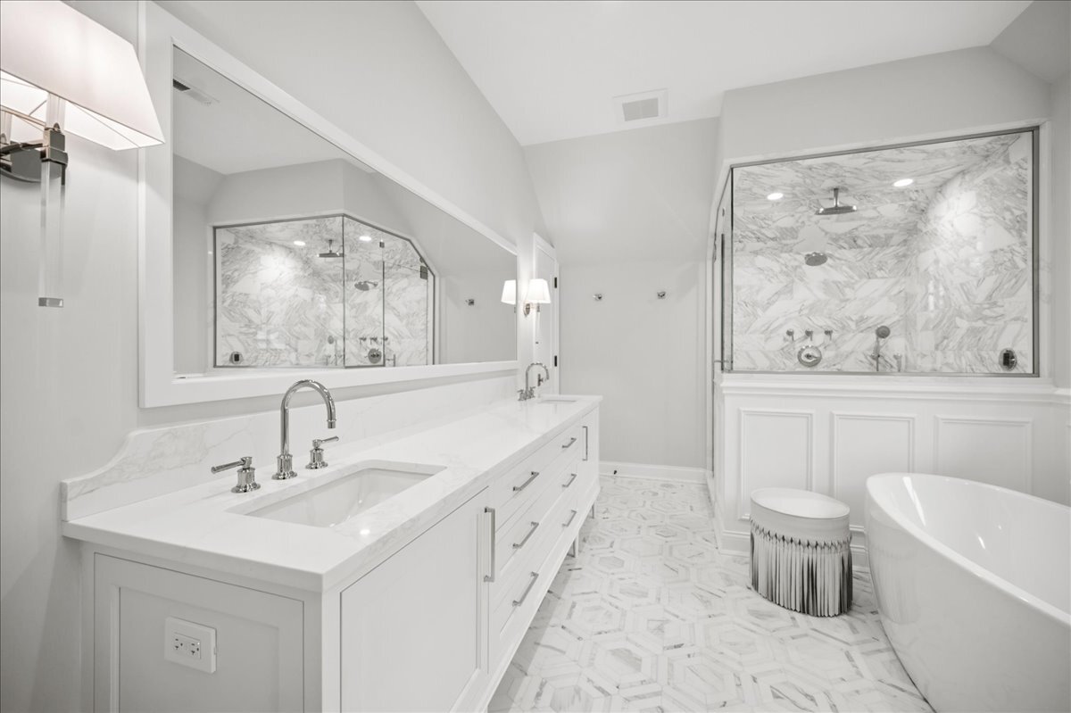 525 Ash Street Winnetka, IL 60093 - Photo 28 of 56 a bathroom with a double vanity sink toilet and a tub