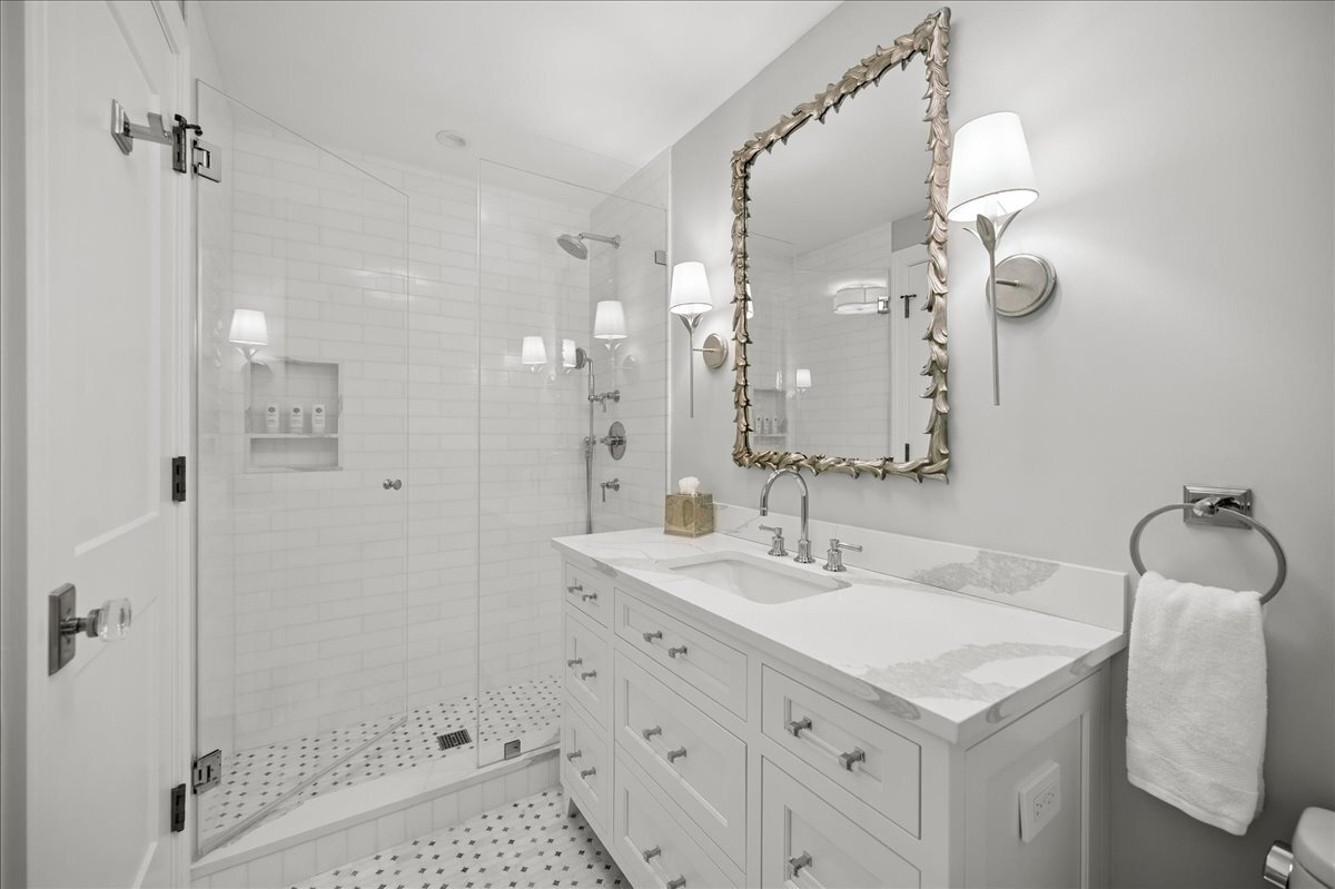 525 Ash Street Winnetka, IL 60093 - Photo 32 of 56 a bathroom with a sink a toilet and shower