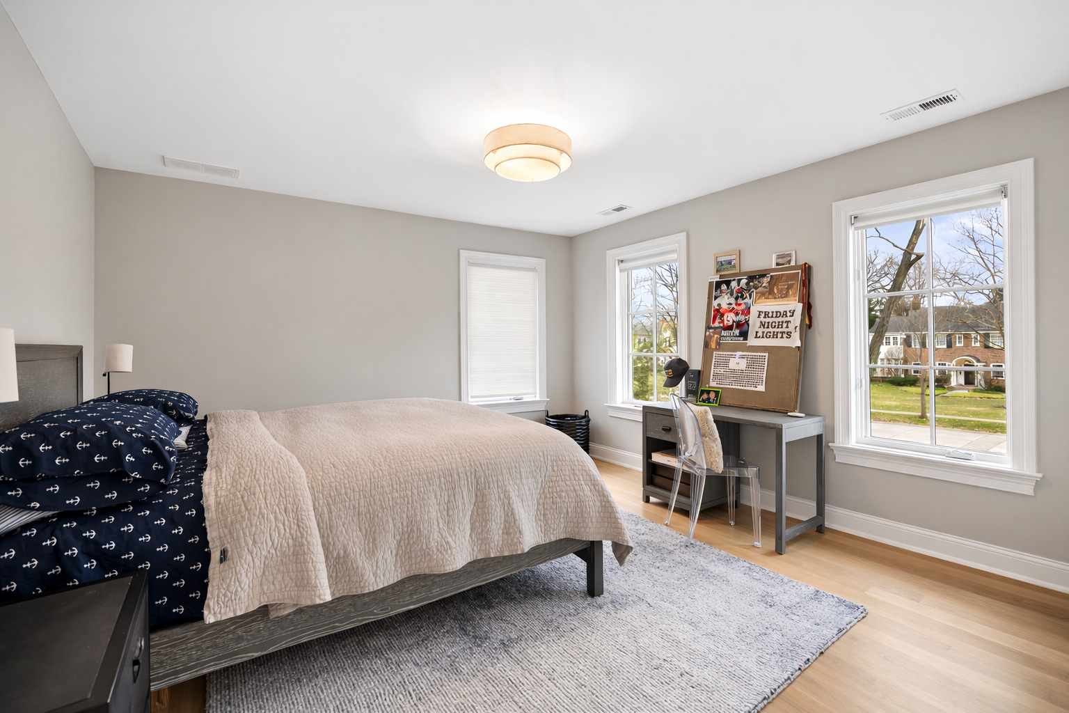 525 Ash Street Winnetka, IL 60093 - Photo 33 of 56 a bedroom with a bed and a table in it with window