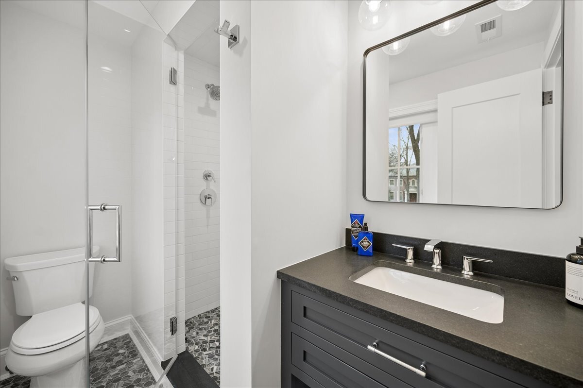 525 Ash Street Winnetka, IL 60093 - Photo 34 of 56 a bathroom with a granite countertop sink mirror and toilet