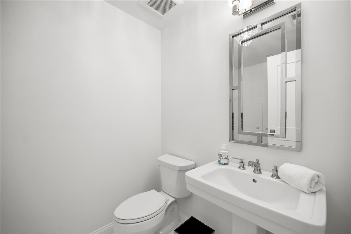 525 Ash Street Winnetka, IL 60093 - Photo 36 of 56 a bathroom with a sink a toilet and mirror