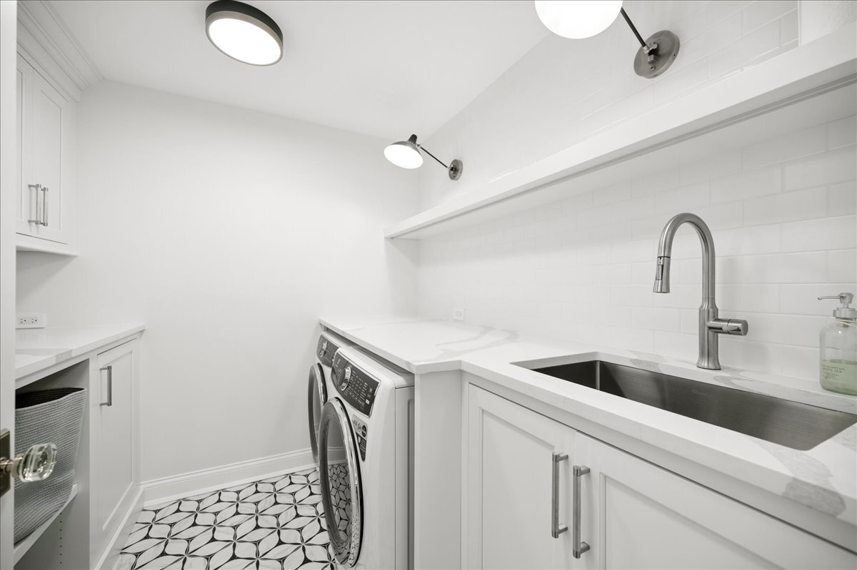 525 Ash Street Winnetka, IL 60093 - Photo 37 of 56 a kitchen with a sink and cabinets