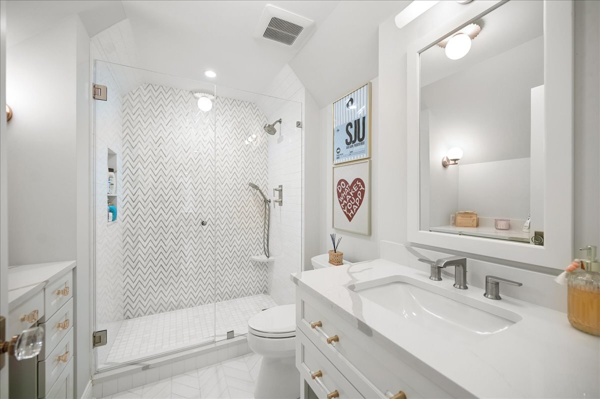525 Ash Street Winnetka, IL 60093 - Photo 42 of 56 a bathroom with a sink a toilet and shower
