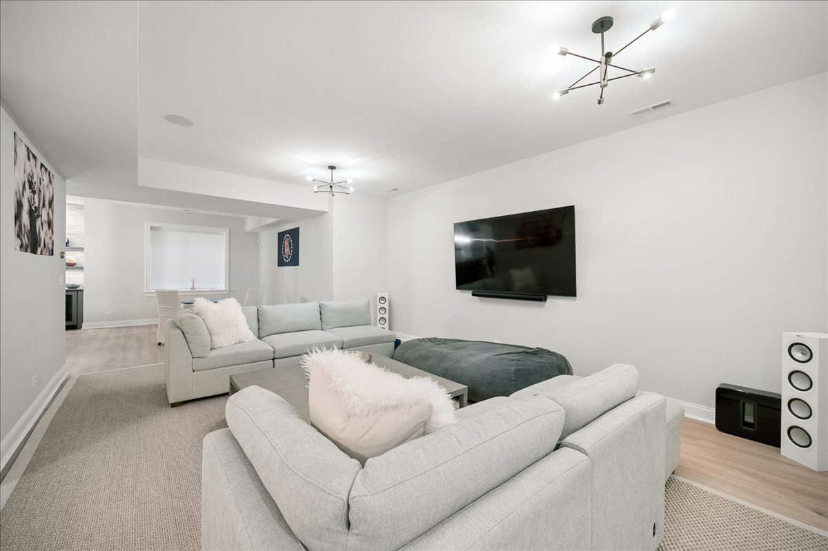 525 Ash Street Winnetka, IL 60093 - Photo 44 of 56 a living room with furniture and a flat screen tv
