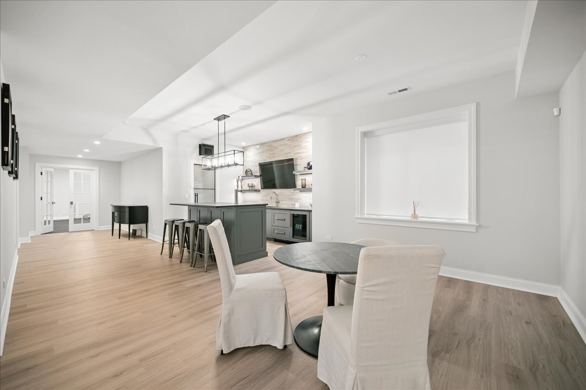 525 Ash Street Winnetka, IL 60093 - Photo 47 of 56 a dining room with furniture and wooden floor