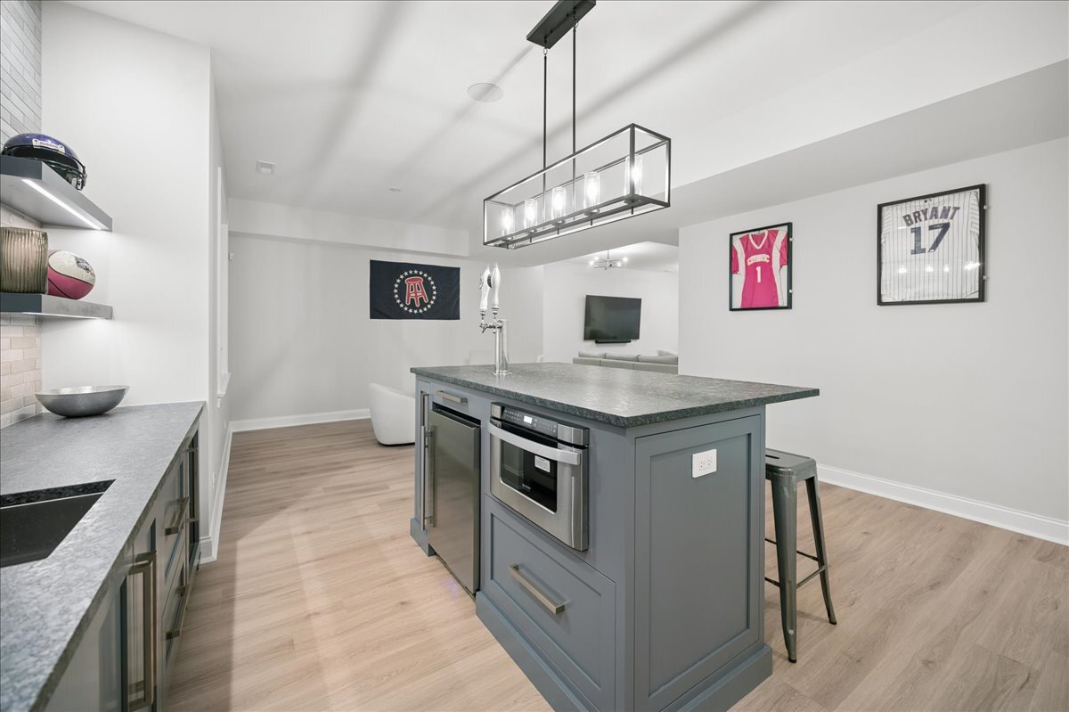 525 Ash Street Winnetka, IL 60093 - Photo 49 of 56 a kitchen with stainless steel appliances granite countertop a stove and a sink
