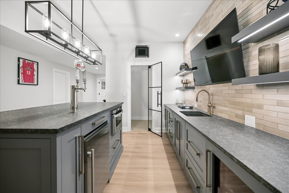 525 Ash Street Winnetka, IL 60093 - Photo 50 of 56 a kitchen with stainless steel appliances granite countertop a sink and a stove