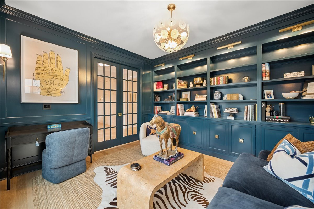 525 Ash Street Winnetka, IL 60093 - Photo 5 of 56 a living room with furniture and a bookshelf